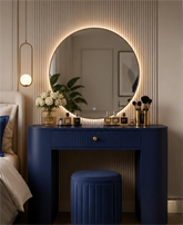 Ivory white and royal blue LED vanity dressing table with round mirror, fluted drawer, gold accents and upholstered stool for luxury bedroom interiors in Pakistan.