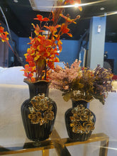 Black and gold ceramic vase set detail view