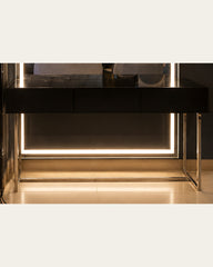 Black drawer console and polished open frame base detail of Luma Frame vanity by Z Galleria
