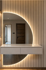 Luna Arc sculptural mirror and warm integrated lighting detail by Z Galleria