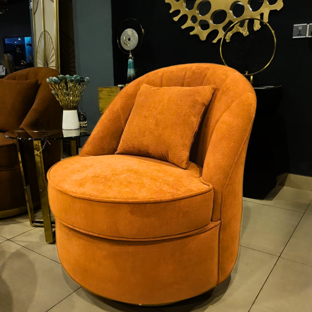 Orange accent living room chair styled in a living room