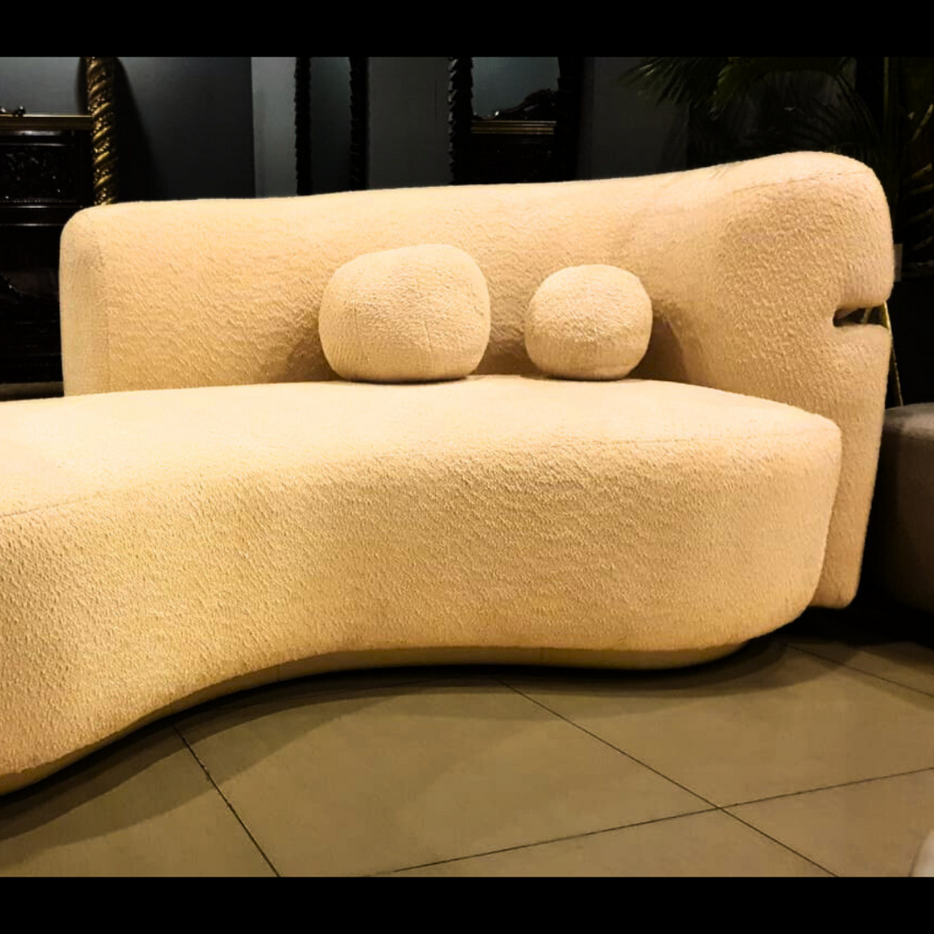 Semi-round cloud boucle sofa styled in a living room
