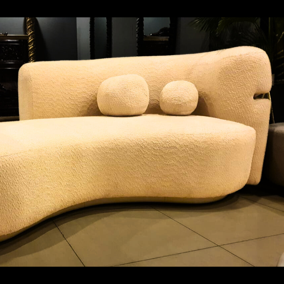 Semi-round cloud boucle sofa styled in a living room