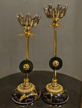 Black and gold candle stand set styled on a console table