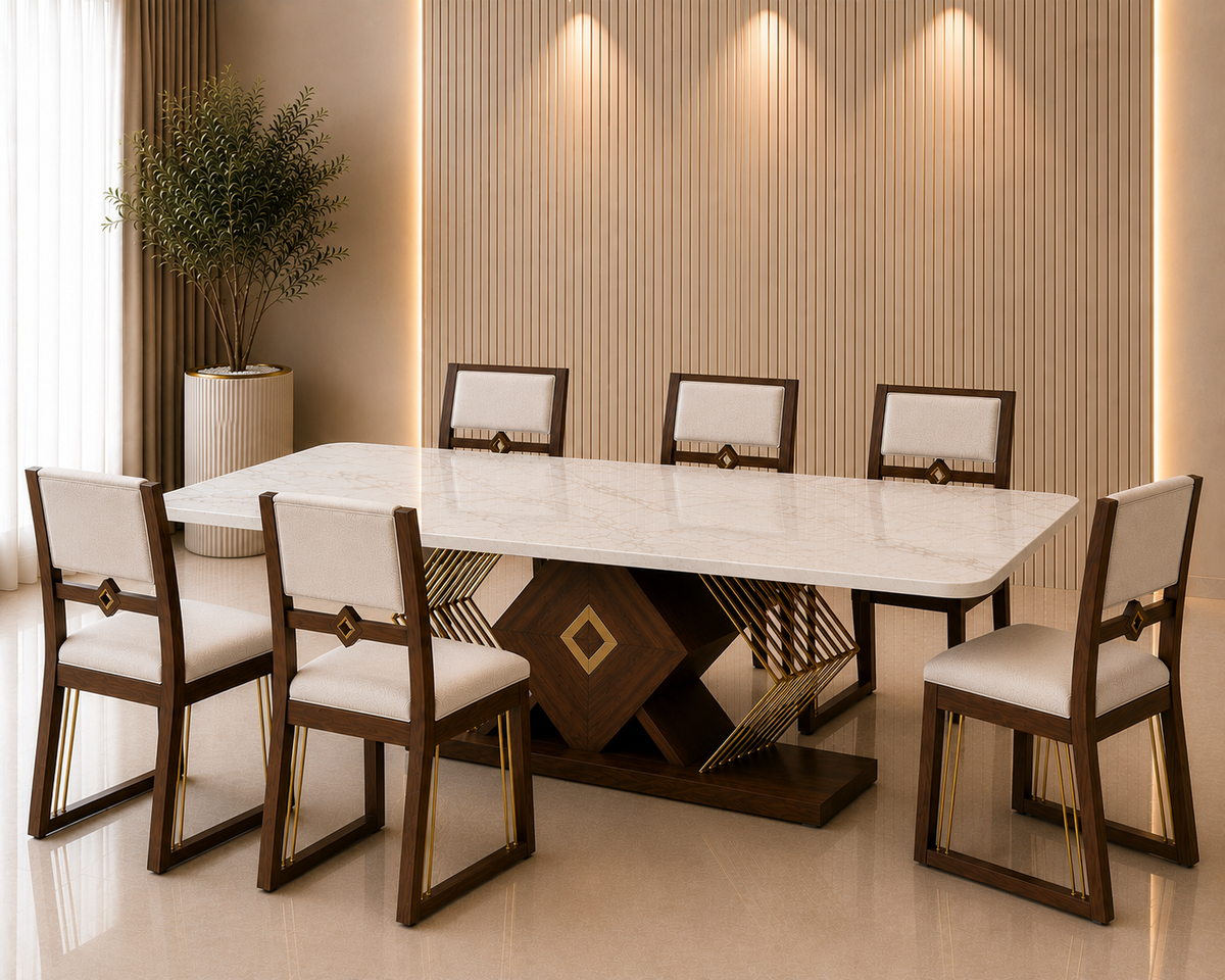 The Facet Marble Dining Set with a white marble top, geometric dark-wood base, gold detailing and six ivory upholstered wooden chairs.
