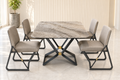 The Kinetic four-seater marble dining set with a grey veined top, interlocking graphite metal base, gold accents and four greige upholstered chairs. Four-seater marble dining table set in Pakistan featuring a grey veined marble top, modern graphite metal frame, gold accents and four comfortable greige upholstered chairs by Z Galleria Lahore.