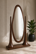 Aurelia full-length oval floor mirror with a solid-wood Sheesham frame, sculpted wooden pillars, adjustable golden joints and rectangular base, available in Pakistan.
