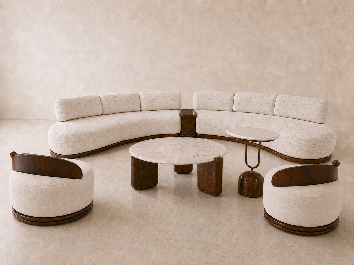 The Ivory Arc Sofa Set featuring a large curved ivory sectional sofa, two rounded accent chairs, dark solid-wood detailing, and matching white marble coffee and side tables.