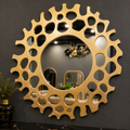 Helios gold round mirror styled on a wall by Z Galleria