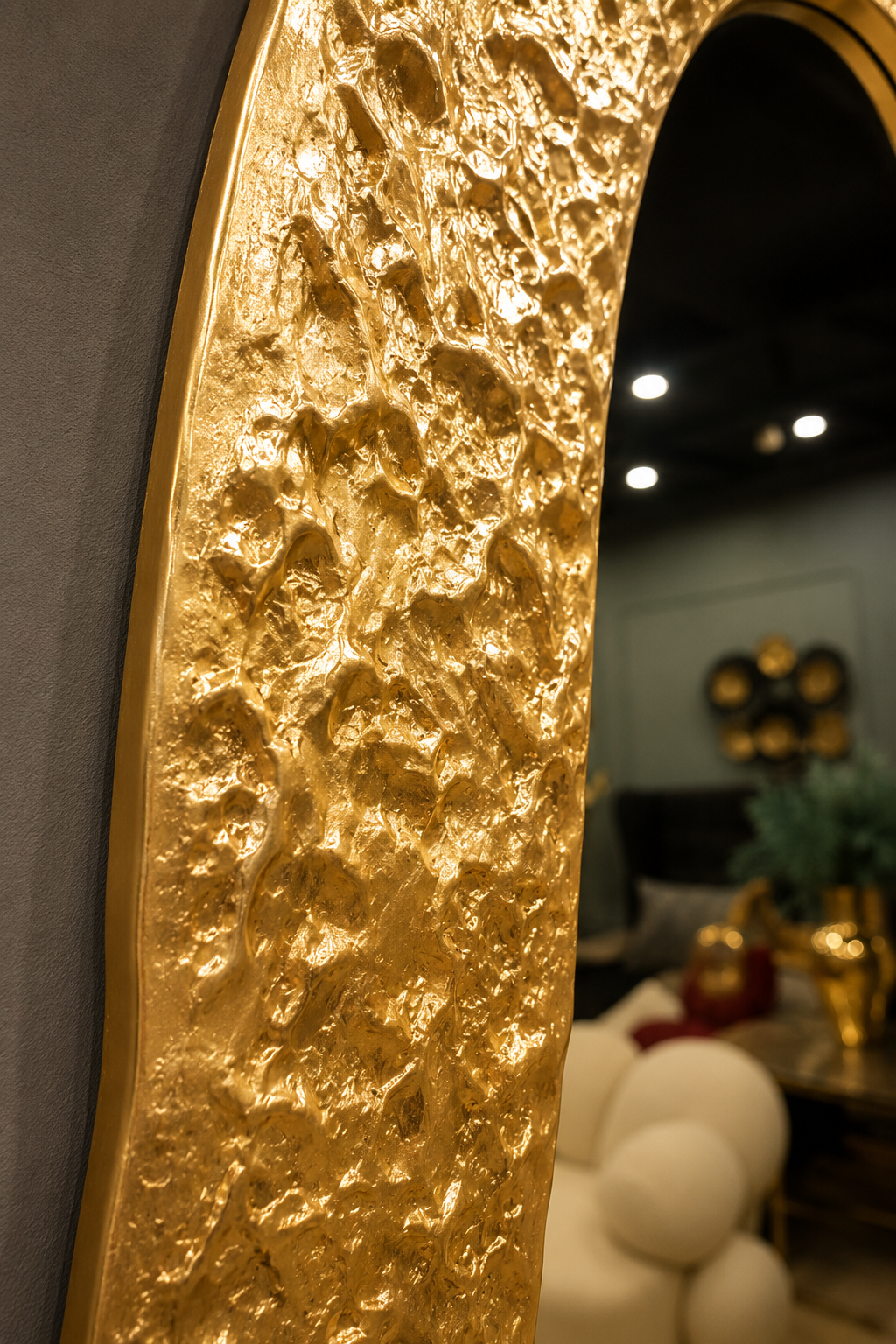 Shahi gold accent mirror styled on a wall