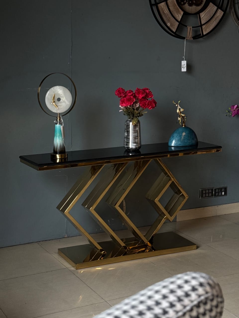 Black and gold console with golden stand detail view