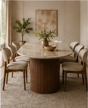 Elara oval dining set side view showing the light sintered stone tabletop, ribbed Sheesham pedestal and warm beige dining chairs.