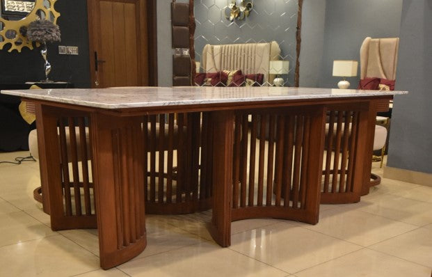 Mambo marble-top dining table styled with chairs