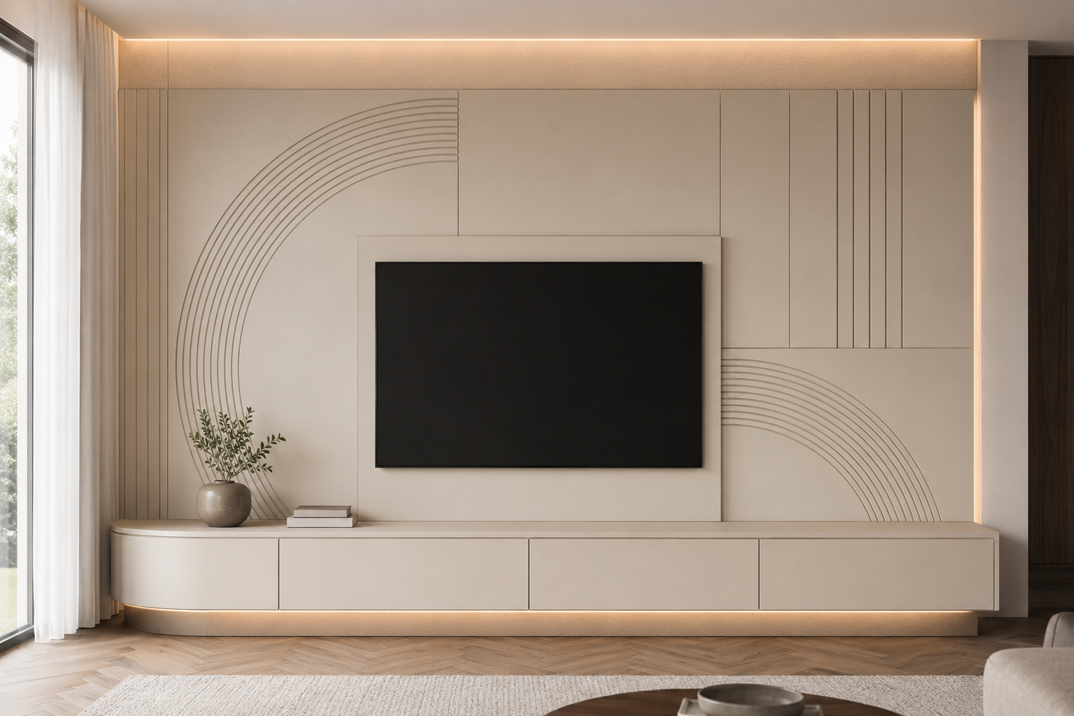 A modern beige TV wall console in a living room setting, featuring a black flat-screen TV mounted in the center, decorative concentric arch and vertical line paneling, warm ambient LED lighting, and a curved storage bench with a small vase and books on top.