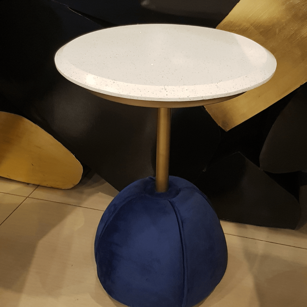 Marble-top accent side table styled in a living room
