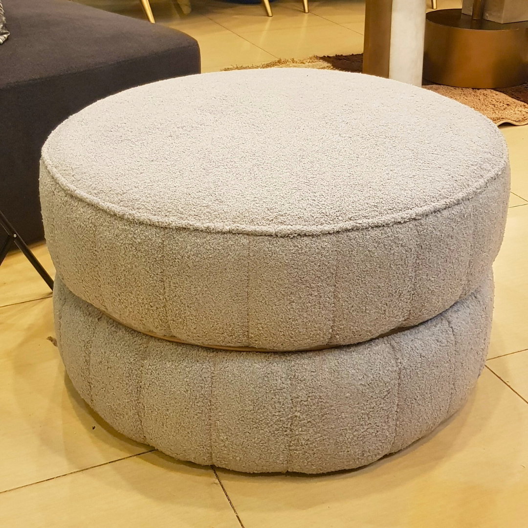Round upholstered ottoman detail view