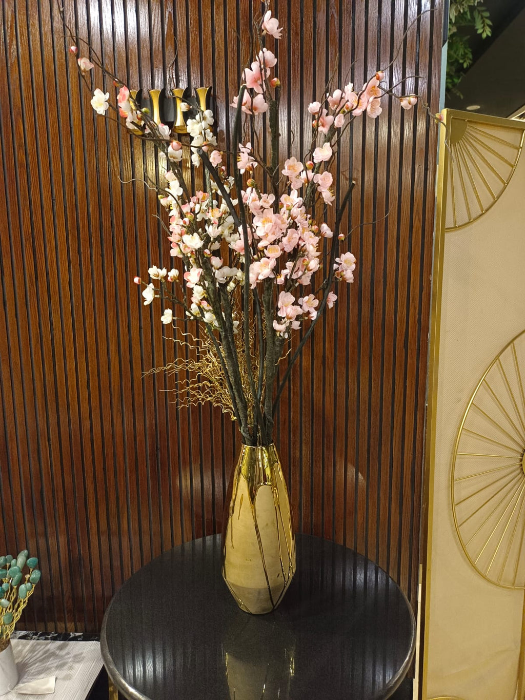 Golden ceramic flower vase detail view