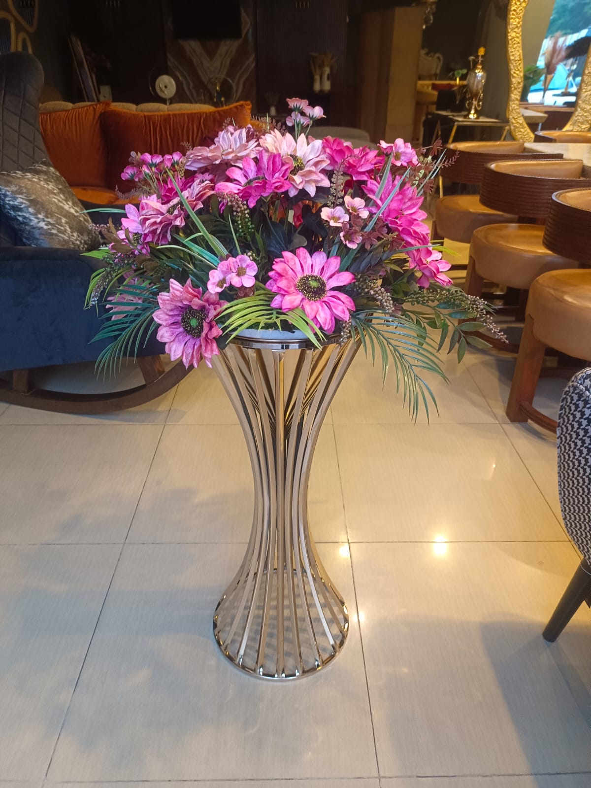 Tall metal floor vase flower stand detail view