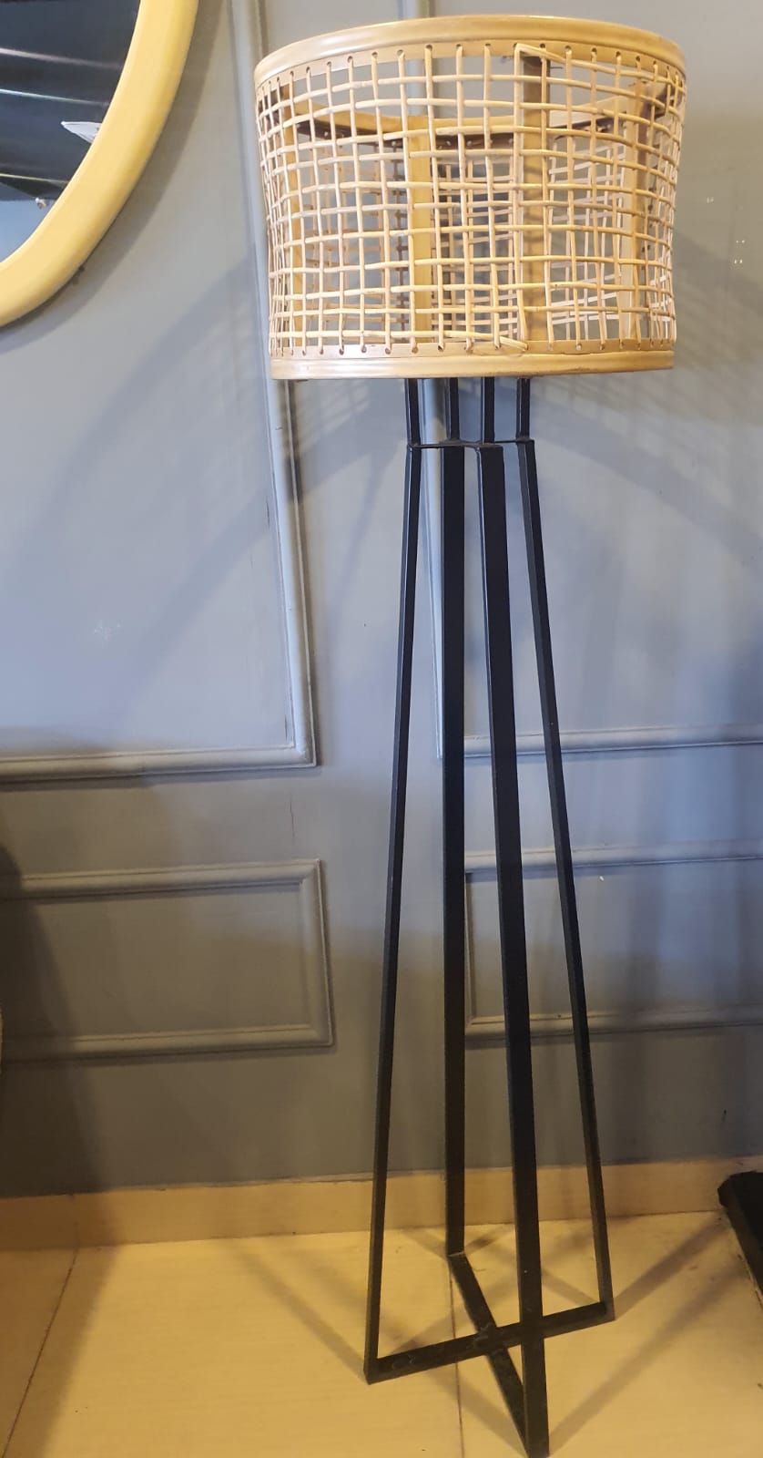 Rattan shade table lamp styled in a room