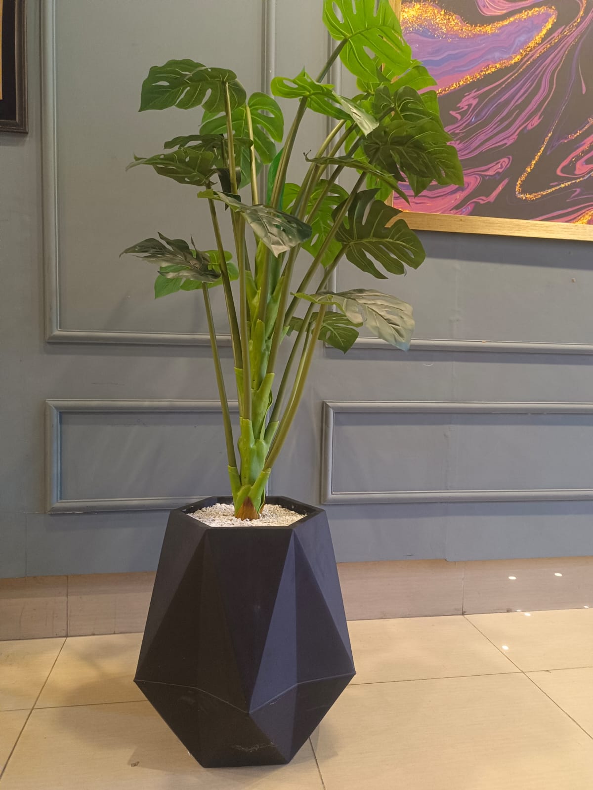 Artificial green leaf tree styled in a room