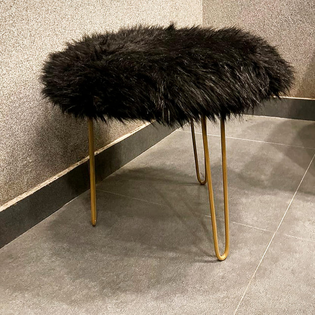 Furry three-legged metal stool detail view