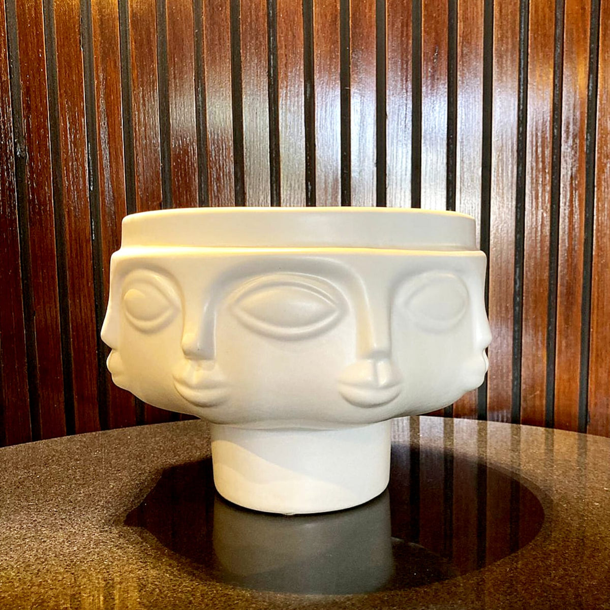 Gilded decorative bowl set styled on a table