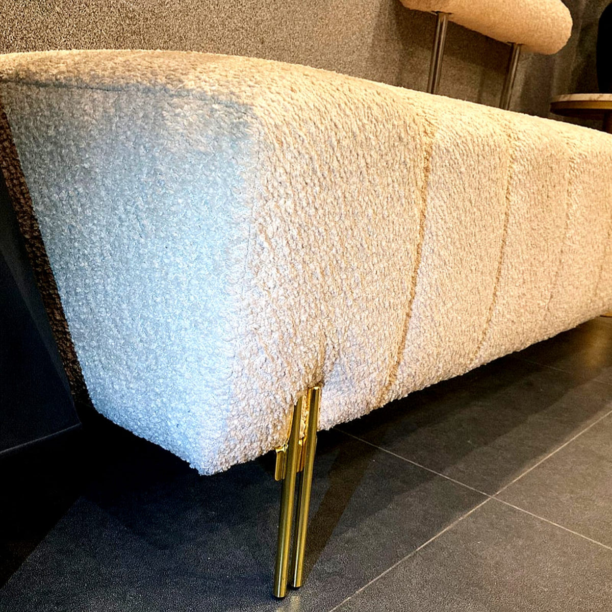 Upholstered bench with gold legs side profile