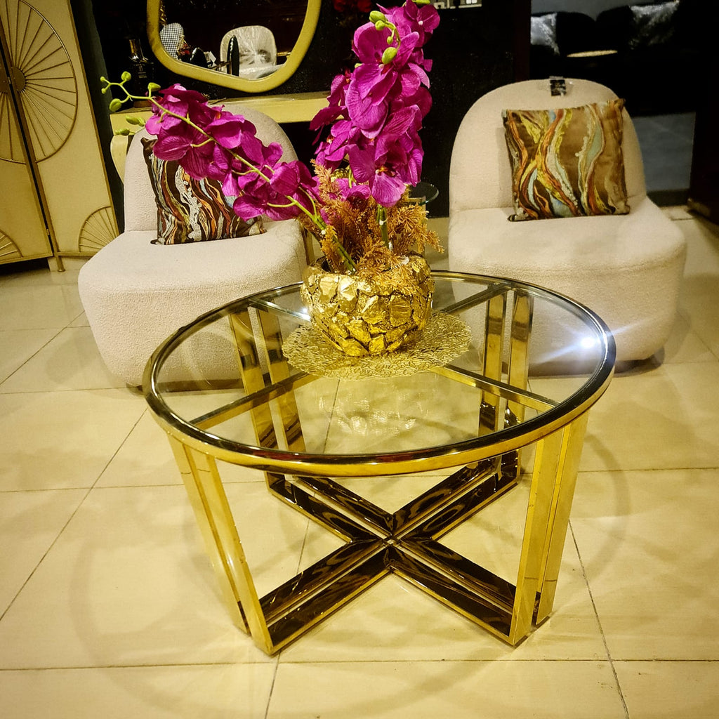 Modern centre table with glass top set styled in a living room