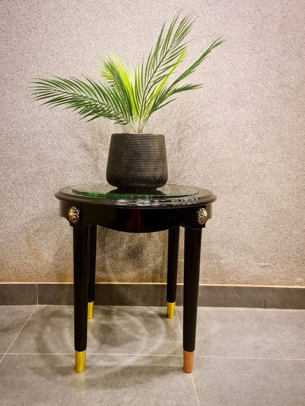 Round wooden coffee table with glass top by Z Galleria