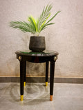 Round wooden coffee table with glass top by Z Galleria