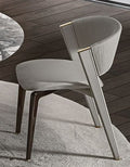 Gray upholstered dining chair with wooden frame