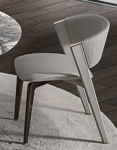 Gray upholstered dining chair with wooden frame
