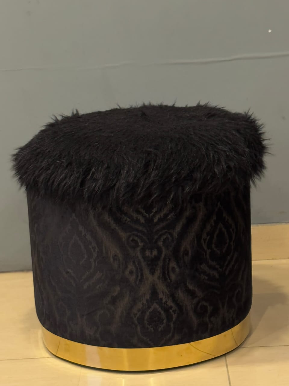 Black Faux Leather Ottoman styled in a living room