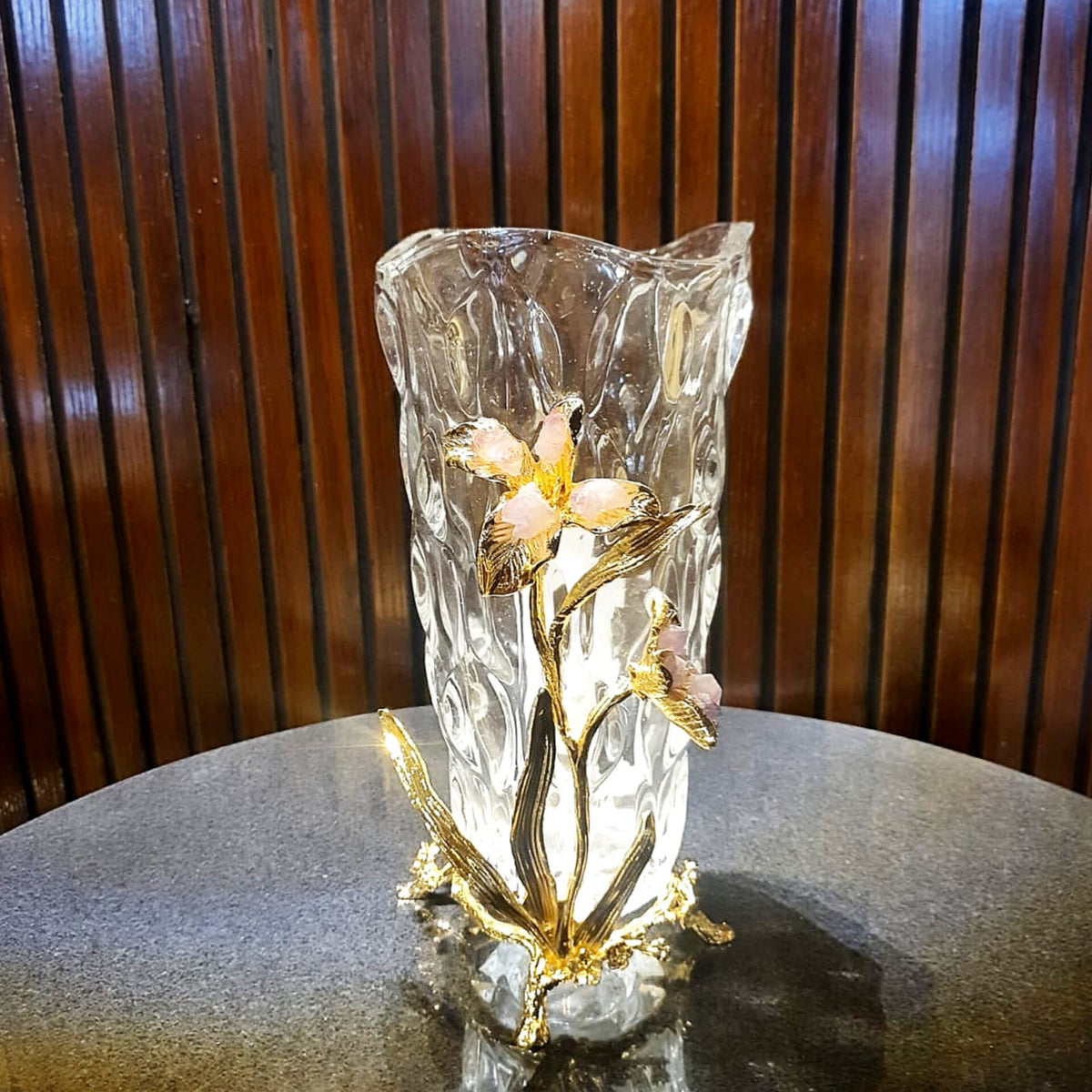 Glass vase with gold metal flower relief detail view