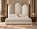 Aurelia Arch Bouclé Bed with solid wood structure and dark wood detailing – luxury bed in Lahore