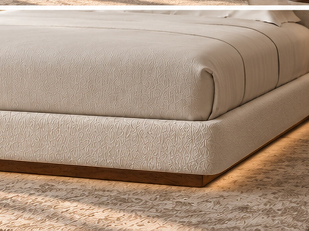 Aurelia Arch Bouclé Bed close-up showing skin-tone bouclé upholstery and recessed dark wood base
