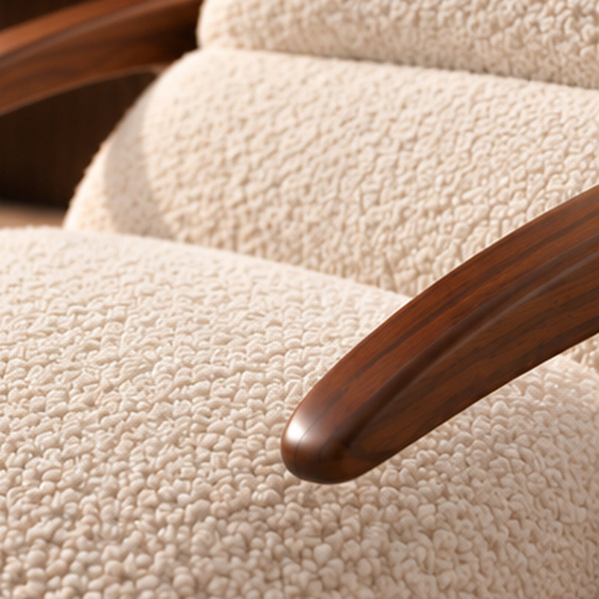 Aurelia Rocking Lounge Chair close-up showing looped cream bouclé texture and sheesham wood arm