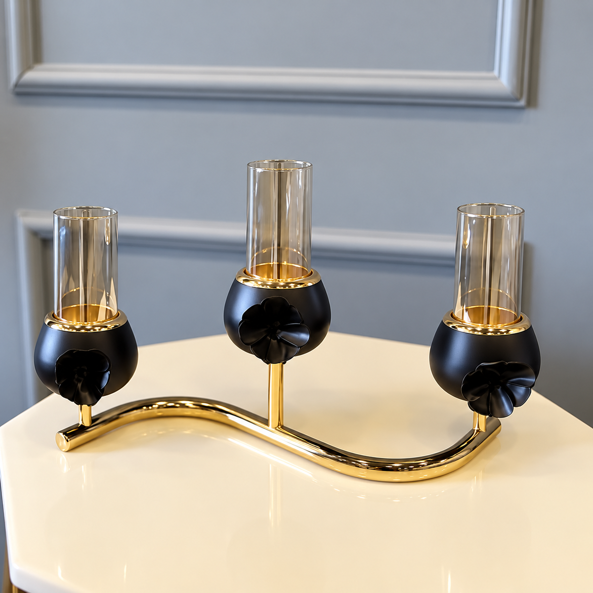 Black three-cup candle stand with gold curved support by Z Galleria