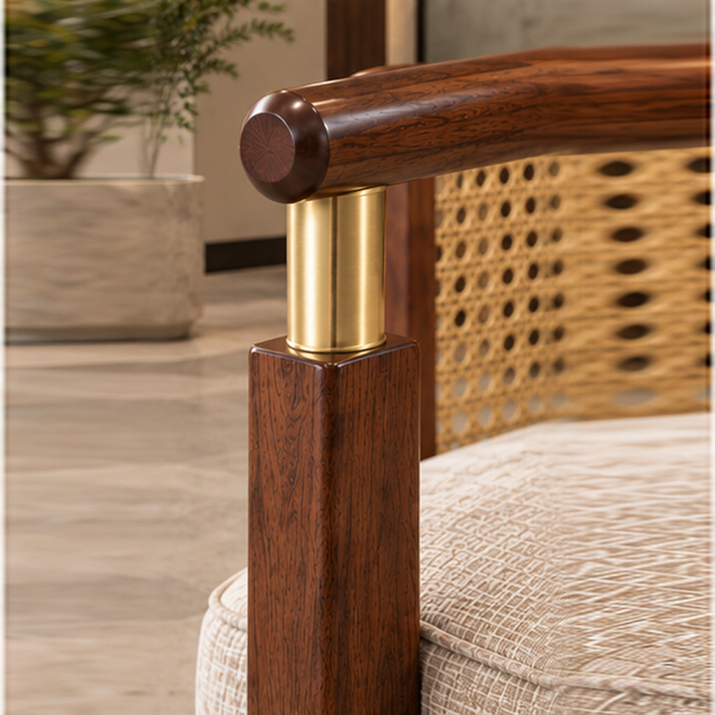 The Heritage Rattan Accent Chair walnut and brass joint close-up with crisp interior background