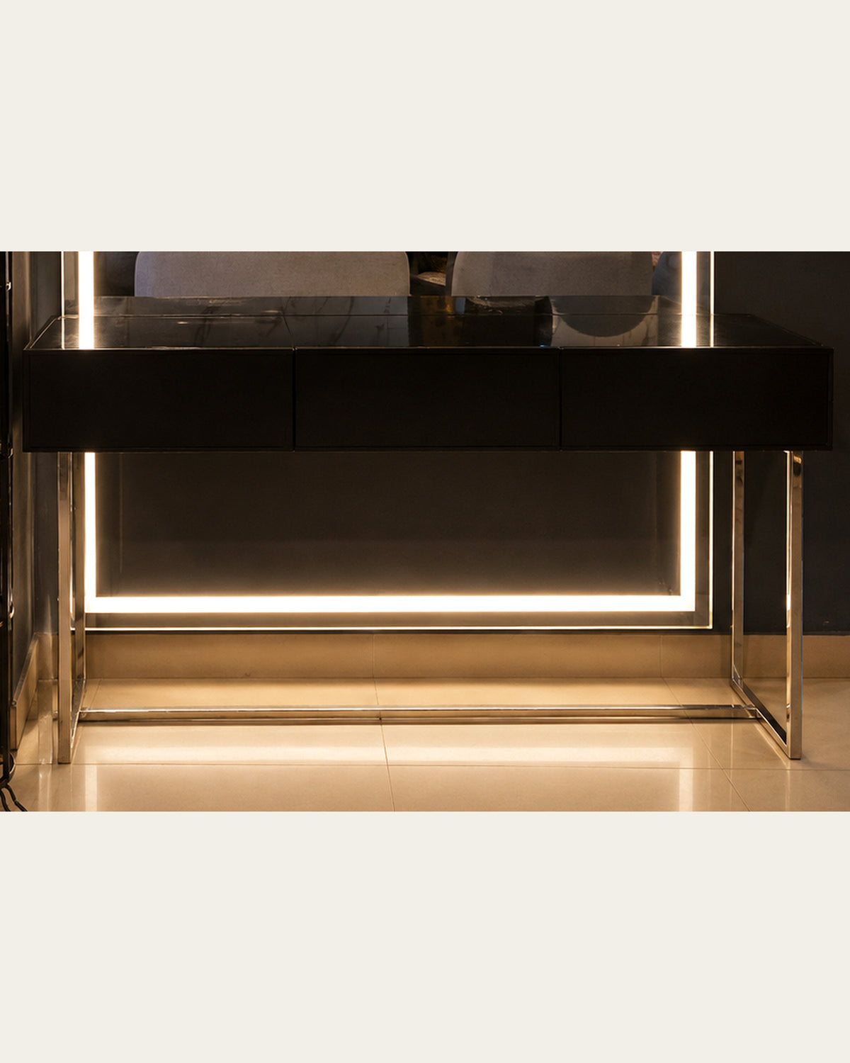 Black drawer console and polished open frame base detail of Luma Frame vanity by Z Galleria