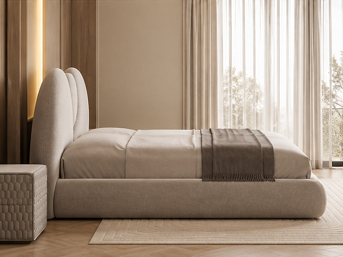 Luna Sculpted Bed in taupe upholstery, side profile showing low rounded base and sculptural headboard by Z Galleria