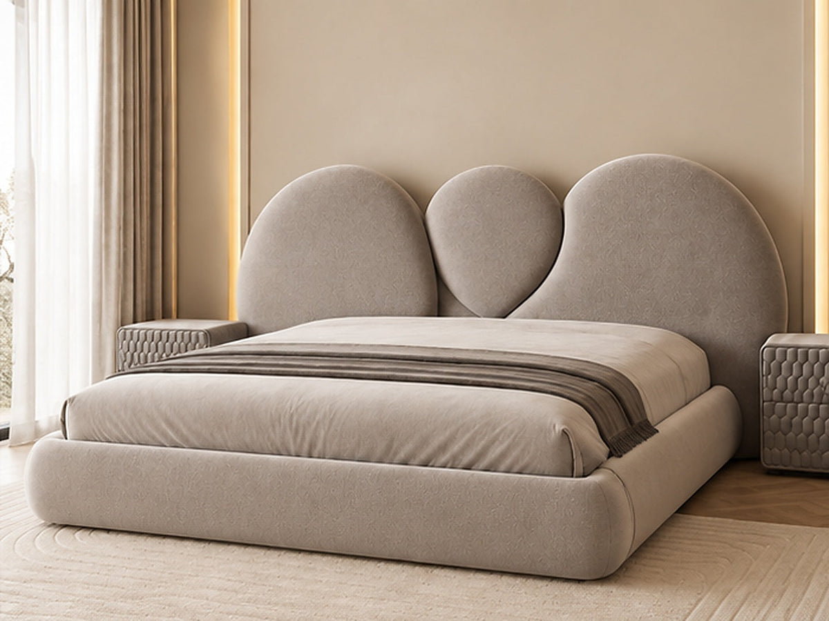 Luna Sculpted Bed in taupe upholstery, three-quarter view showing rounded upholstered frame by Z Galleria