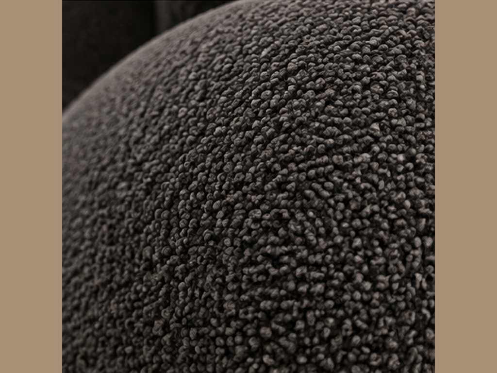Close-up of charcoal boucle upholstery on Noir Pleat Lounge Chair