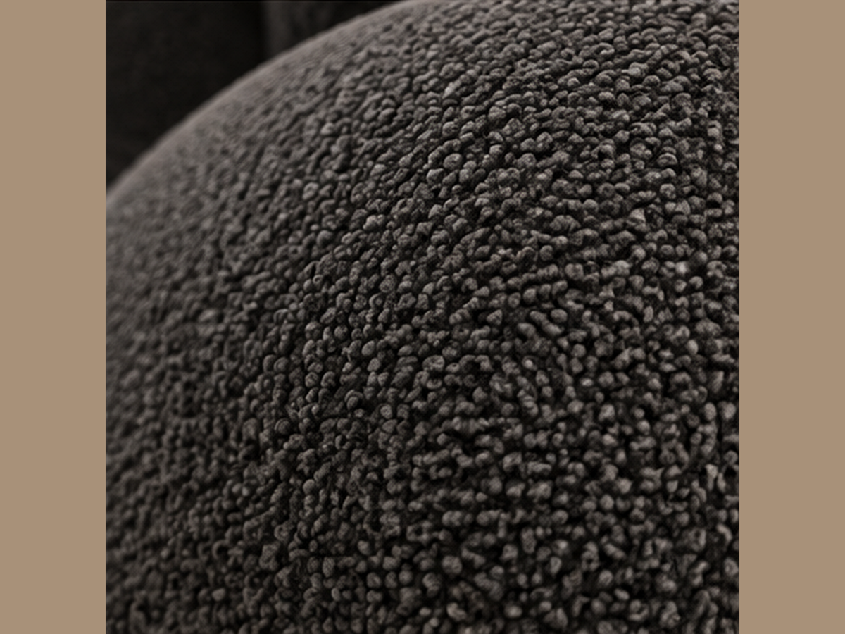 Close-up of charcoal boucle upholstery on Noir Pleat Lounge Chair