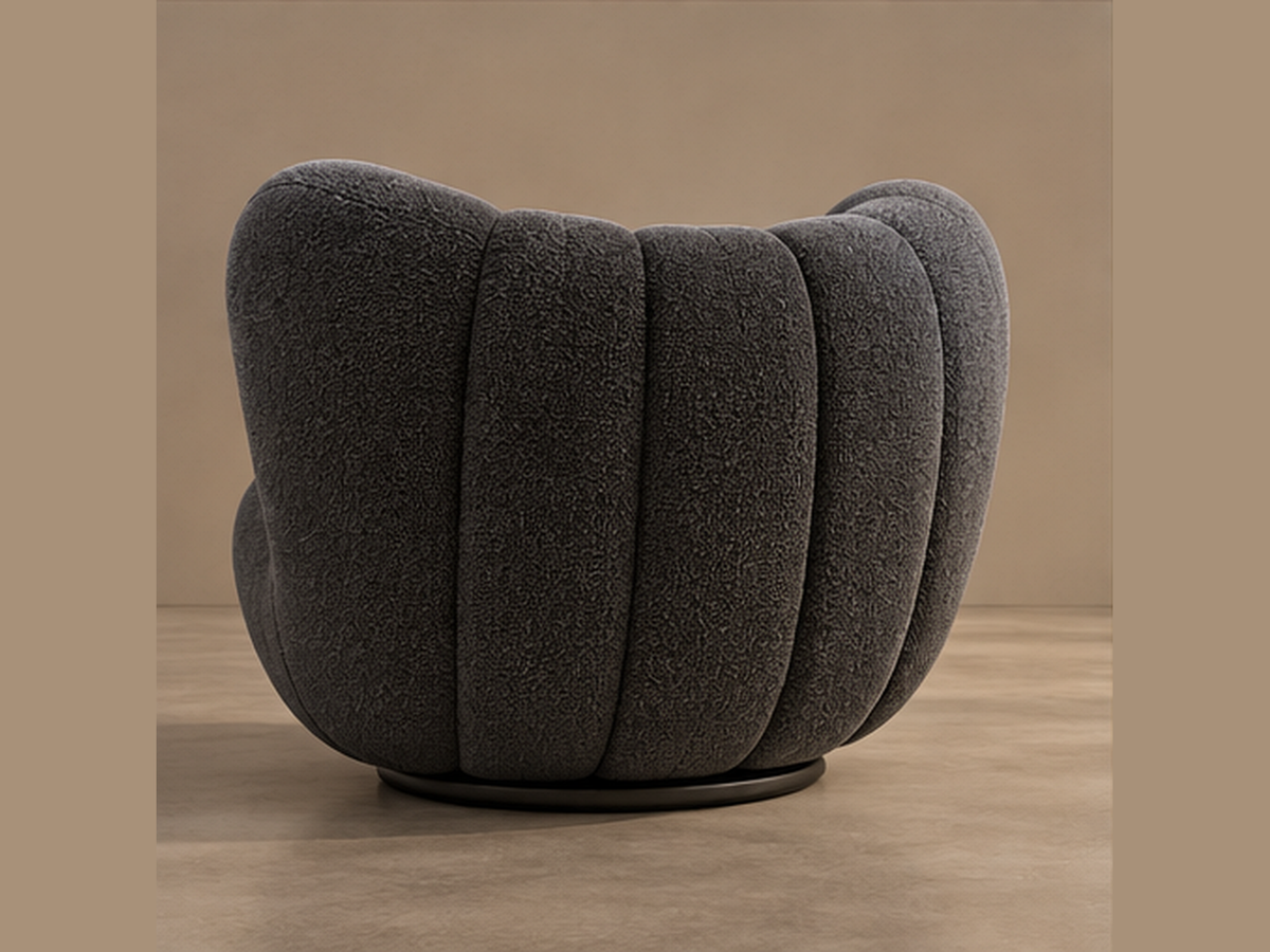 Rear three-quarter view of Noir Pleat Lounge Chair with sculpted channel back