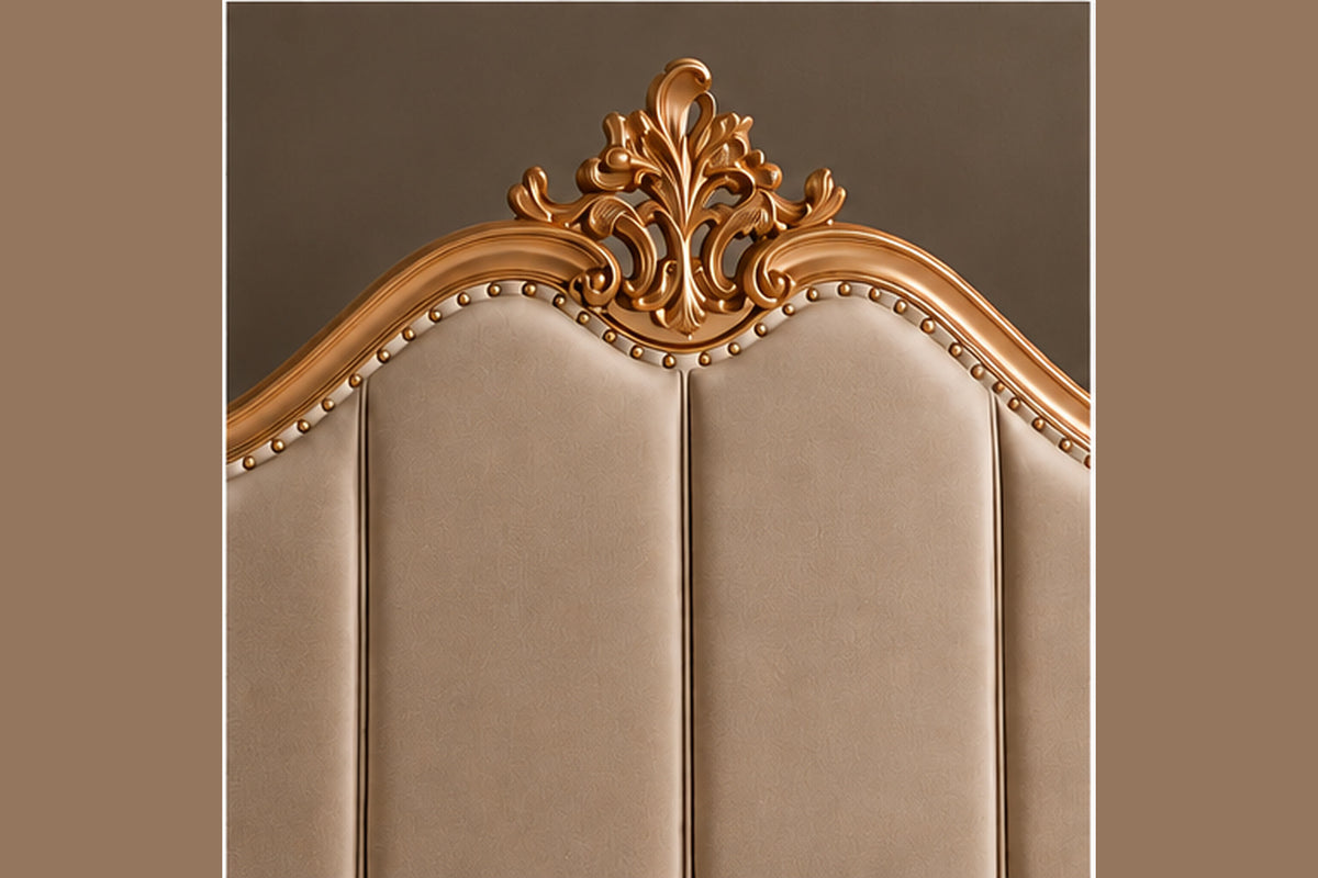 Regalia Crest Bed close-up showing ornate crest, gold carving and upholstered headboard detail