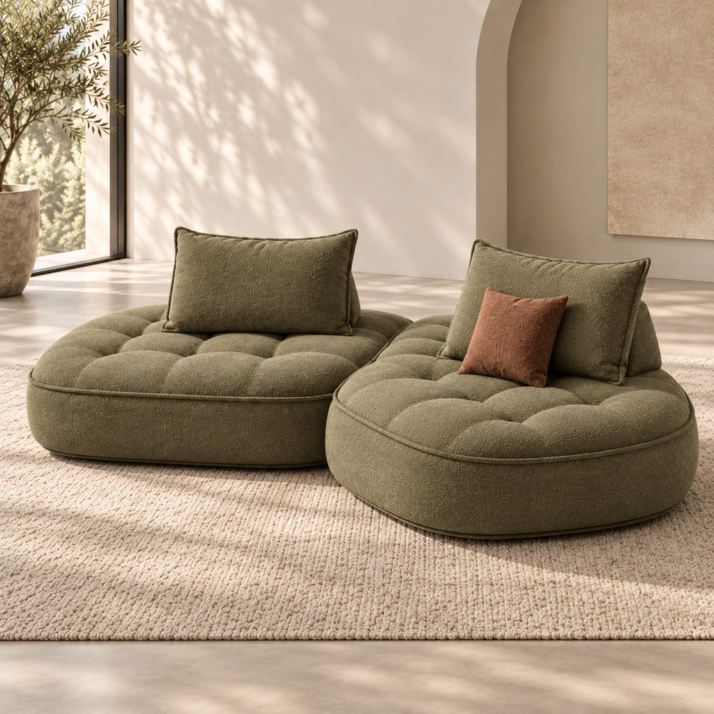 Front view of the Nuvia Lounge Sofa in olive bouclé, showing asymmetrical staggered cushions, deep tufting and rounded low-profile modules