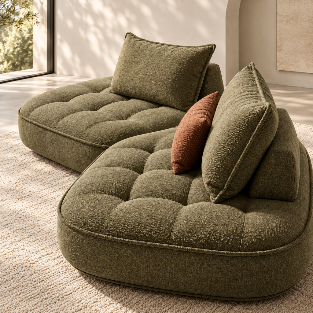 Close-up lifestyle view of quilted bouclé upholstery and generous cushions on the Nuvia Lounge Sofa
