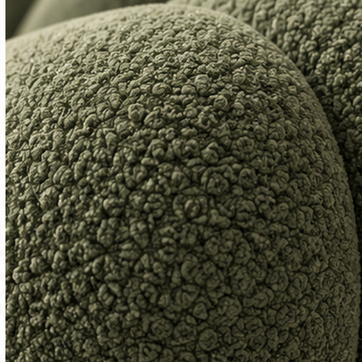 Close-up of moss green boucle upholstery on Verdure Petale Lounge Chair