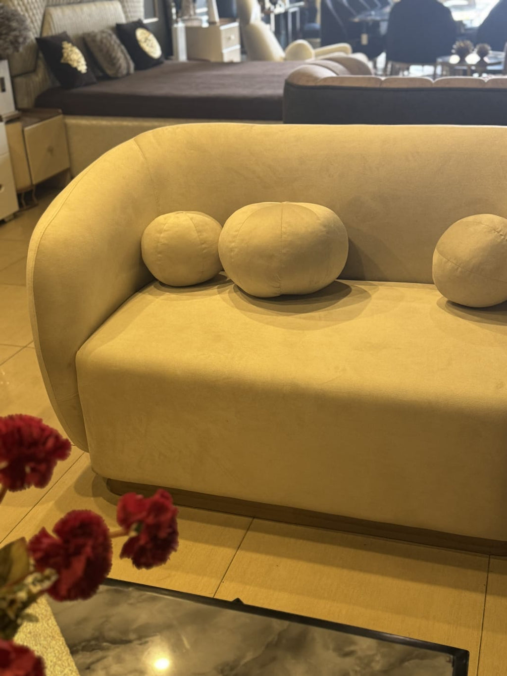 Modern white 2-seater sofa styled in a living room